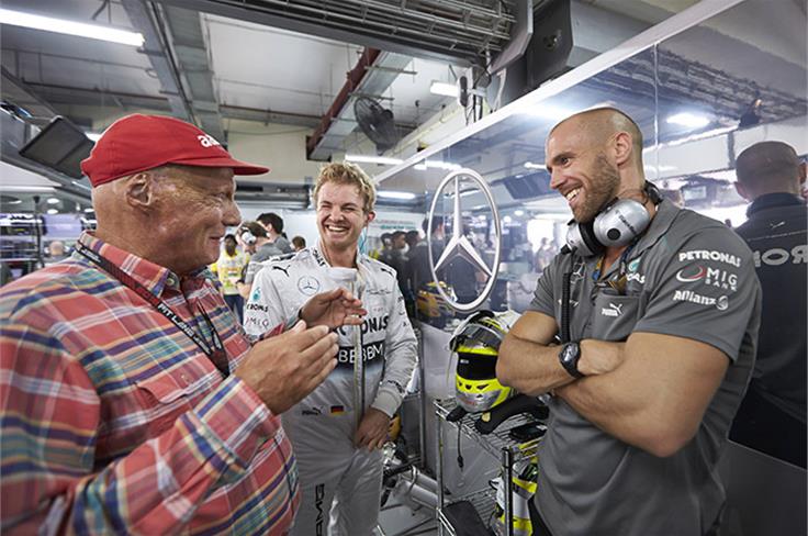 Niki Lauda and Nico Rosberg in the Mercedes garage.